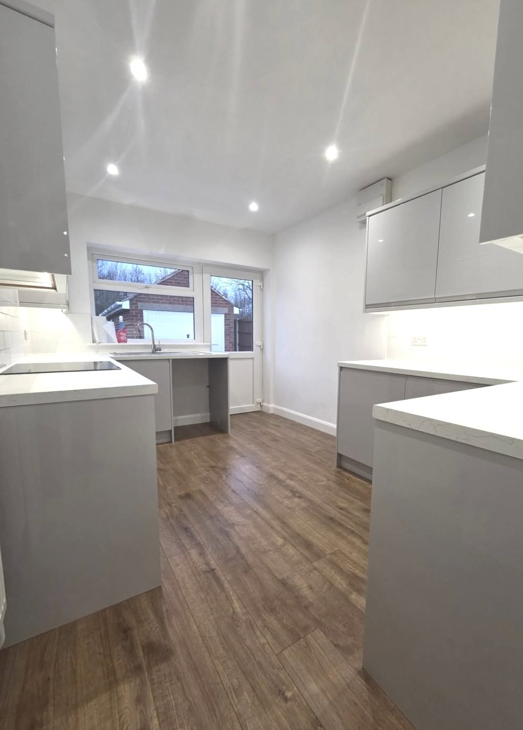 Newly rewired kitchen with recessed downlights and new sockets